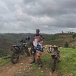 Children enjoying a dirt bike tour in Lombok with a scenic outdoor background.