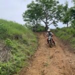 Off-road dirt bike trail in Lombok during a family adventure.